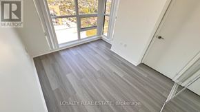 Toronto (Yorkdale-Glen Park) condo for rent - A room with a view of the city through a large window.