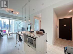 Toronto (Church-Yonge Corridor) condo for rent - A modern kitchen with a view of the city.