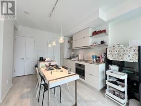 Toronto (Church-Yonge Corridor) condo for rent - A kitchen with a table and chairs in the middle of the room.