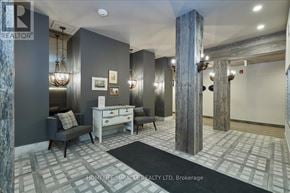 New Tecumseth (Alliston) condo for rent - A well-lit room with a desk, chair, and a large column.