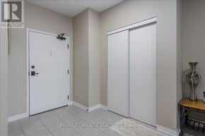 New Tecumseth (Alliston) condo for rent - A room with a white door and a brown cabinet.
