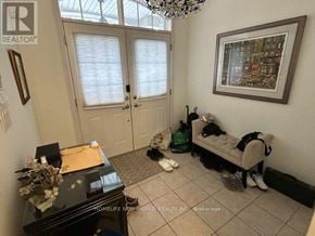 Vaughan (Patterson) townhouse for rent - A room with a piano, a bench, and a chandelier.