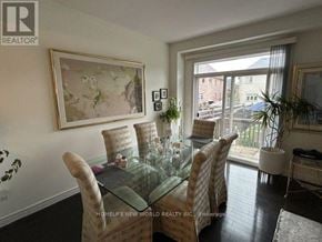 Vaughan (Patterson) townhouse for rent - A dining room with a glass table and chairs.