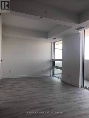 Toronto (Yorkdale-Glen Park) condo for rent - A room with a sliding glass door leading to a balcony.