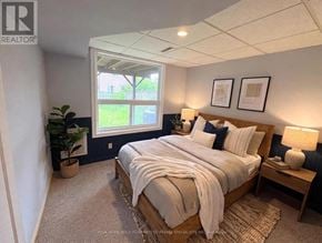 Ajax (South East) apartment for rent - A bedroom with a large bed and a window.