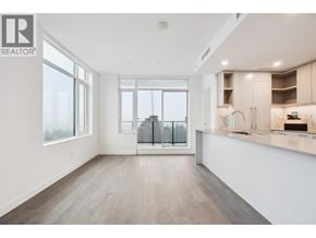 Burnaby apartment for rent - A spacious, well-lit kitchen and living room with a view of the city.
