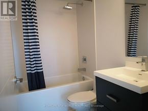 Toronto (Church-Yonge Corridor) condo for rent - A white bathroom with a toilet, sink, and shower.