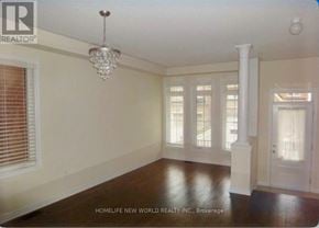 Richmond Hill (Oak Ridges) apartment for rent - A room with a chandelier, a door, and a window.