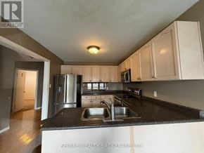 London South (South T) apartment for rent - A kitchen with a sink and a refrigerator.
