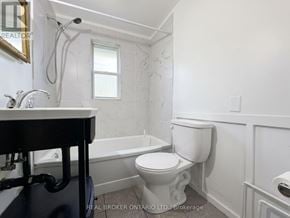 New Tecumseth (Beeton) duplex for rent - A white bathroom with a toilet, sink, and bathtub.