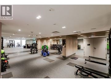 Richmond apartment for rent - A gym with a variety of equipment including treadmills, stationary bikes, and weight machines.