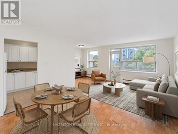 Toronto (Parkwoods-Donalda) condo for rent - A well-lit, spacious living room with a dining table set for six.