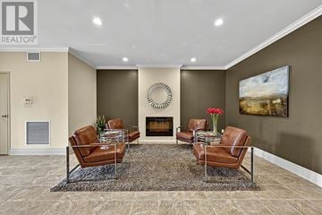 Blue Mountains condo for rent - A living room with a fireplace and a painting on the wall.