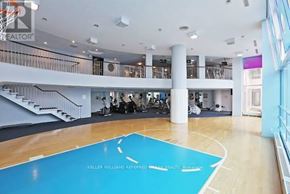 Toronto (Moss Park) condo for rent - A basketball court in a spacious room with a balcony.