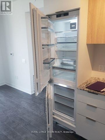 Toronto (Banbury-Don Mills) condo for rent - A kitchen with a refrigerator and a counter.