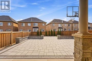 Oakville (Go Glenorchy) apartment for rent - A basketball hoop is mounted on a pole in a backyard.