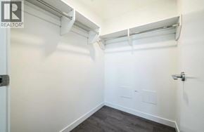 Burnaby apartment for rent - A white wall with a door and a small white box on the wall.