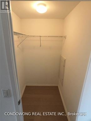 Toronto (Bay Street Corridor) condo for rent - A small, empty closet with a light on.