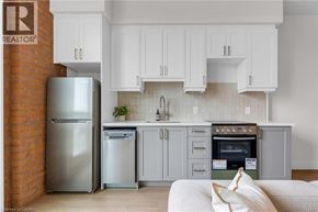 Hamilton apartment for rent - A kitchen with a refrigerator and a washing machine.