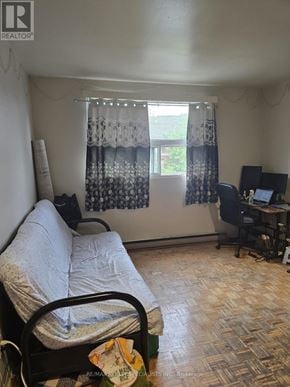Toronto (Dufferin Grove) multi-family for rent - A bedroom with a bed, desk, and chair.