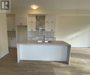 Vaughan (Vellore Village) townhouse for rent - A white kitchen with a counter and cabinets.