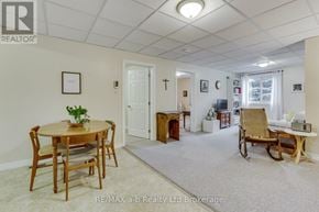 Woodstock (Woodstock - North) multi-family for rent - A room with a table and chairs in it.