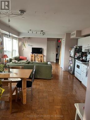 Toronto (Palmerston-Little Italy) multi-family for rent - A room with wooden flooring and a window with blinds.