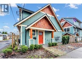 Bc apartment for rent - A blue house with a red door is for sale.