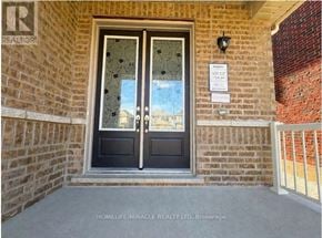 Georgina (Sutton & Jackson's Point) apartment for rent - A door with glass panels and a sign on the wall above it.