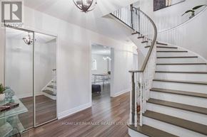 Mississauga (Meadowvale) apartment for rent - A staircase with a metal railing and wooden steps leads to a bedroom.