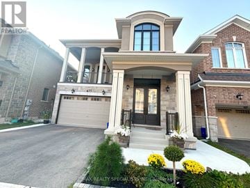 Milton (Walker) apartment for rent - A house with a front yard and a garage.