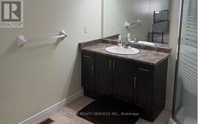 Hamilton (Hannon) apartment for rent - A bathroom with a sink, mirror, and cabinets.
