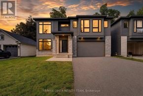 Ottawa apartment for rent - A modern house with a garage is shown in the image.