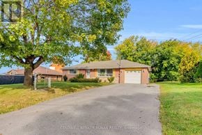 King (Schomberg) apartment for rent - A house with a driveway in front of it is for sale with Coldwell Banker Ronan Realty in Brokerage.