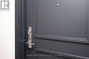 Toronto (Mimico) condo for rent - A door with a handle and a lock on it.