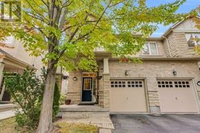 Caledon townhouse for rent - A house with a tree in front of it.