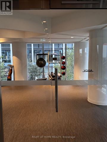 Toronto (Regent Park) condo for rent - A yoga studio is located in the Brokerage of a real estate office.