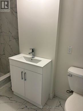 Barrie (Grove East) apartment for rent - A white bathroom with a sink and toilet.