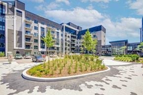 Oakville (Go Glenorchy) condo for rent - A modern building complex with a landscaped courtyard in the foreground.