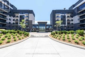 Oakville (Go Glenorchy) condo for rent - A modern building complex with a central courtyard and surrounding greenery.