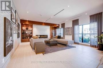 Oakville (Go Glenorchy) condo for rent - A spacious living room with a large couch and a coffee table.