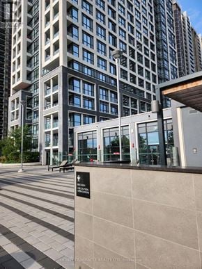 Toronto (Islington-City Centre West) condo for rent - A building with a sign that says "HOTEL PEMIRALE REALTY LTD, Brokerage".