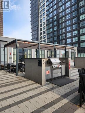 Toronto (Islington-City Centre West) condo for rent - A small outdoor kitchen area with a grill and sink.