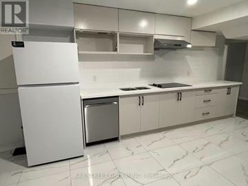 Toronto (Newtonbrook West) apartment for rent - A white fridge and dishwasher in a kitchen with white cabinets.