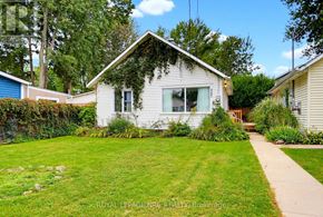 Fort Erie (Crystal Beach) apartment for rent - A white house with a green lawn in front.