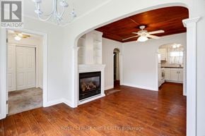 Fort Erie (Crystal Beach) apartment for rent - A living room with a fireplace and a chandelier.