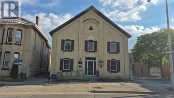 Brantford apartment for rent - A building with a sign that says REALTOR on the top left corner.