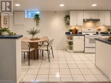 Newmarket (Gorham-College Manor) apartment for rent - A kitchen with a table and chairs in the middle of the room.