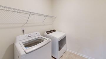 Statesville apartment for rent - A white dishwasher and microwave are in a small kitchen.