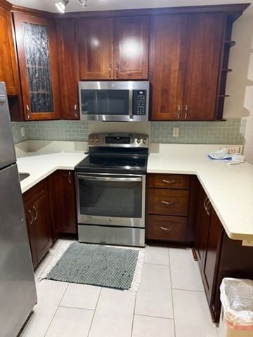 Honolulu apartment for rent - A kitchen with a stove top oven and microwave.
